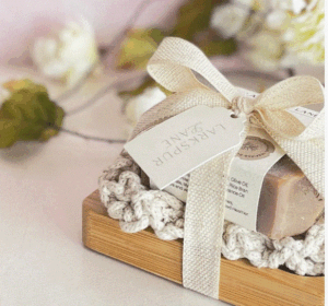 Minimalist luxury soap packaging design with elegant white box and gold logo.