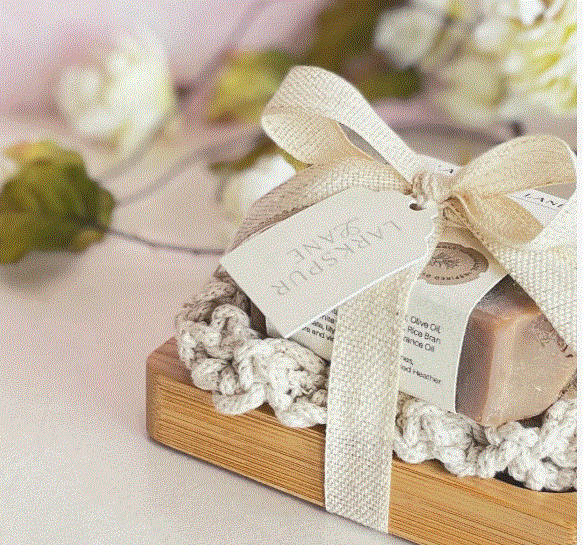 Minimalist luxury soap packaging design with elegant white box and gold logo.